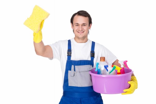 Cleaner maintaining lift lobby and communal surfaces in Kensington