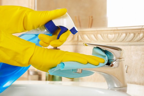 Technician treating stains during mattress cleaning in a Kensington property
