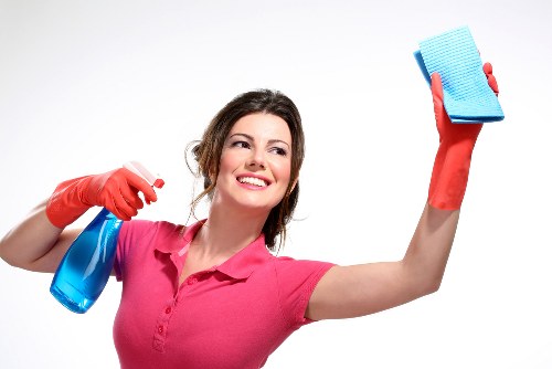 Window cleaner working on a Kensington townhouse with care